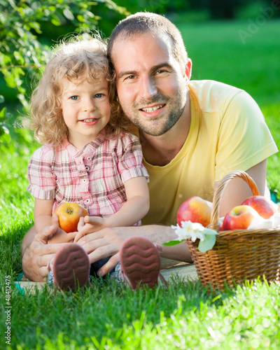 Photo: Man and child having picnic Man and child having picnic
