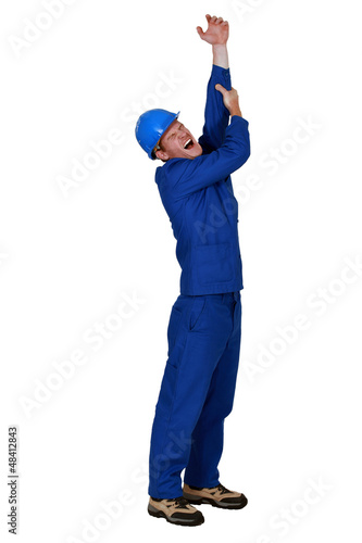 Photo: Tradesman crying out in pain Tradesman crying out in pain
