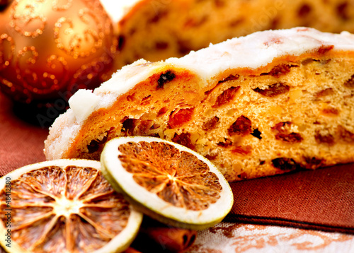 Photo: Christmas Stollen. Traditional Sweet Fruit Loaf with Icing Sugar Christmas Stollen. Traditional Sweet Fruit Loaf with Icing Sugar