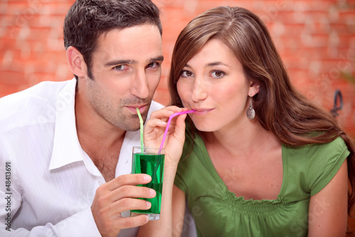 Photo: Couple drinking cocktails Couple drinking cocktails