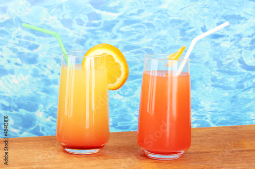 Photo: Two cocktails on blue background Two cocktails on blue background