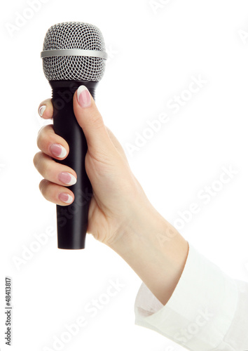 Photo: female hand with microphone isolated on white female hand with microphone isolated on white