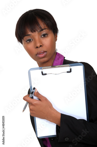 Photo: Businessman holding clip-board and pen Businessman holding clip-board and pen