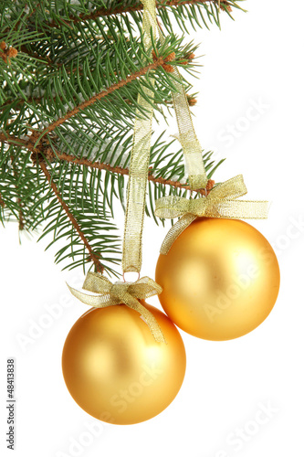 Photo: Christmas balls on fir tree, isolated on white Christmas balls on fir tree, isolated on white