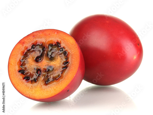 Photo: Two ripe tamarillo isolated on white Two ripe tamarillo isolated on white