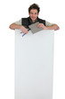 tiler holding an ad board