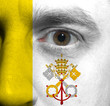 face with the Vatican City flag painted on it