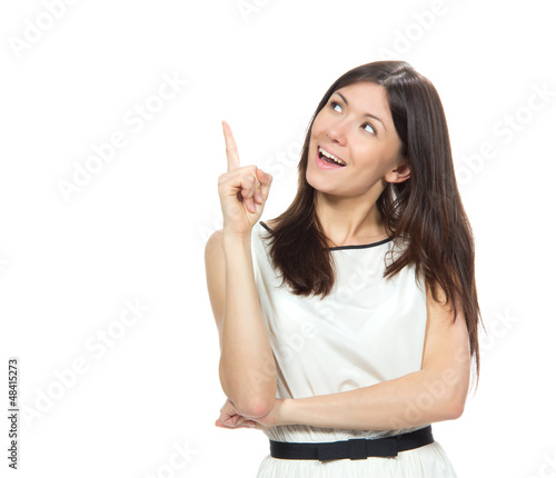 Photo: Portrait of young woman pointing hand finger at corner with copy Portrait of young woman pointing hand finger at corner with copy