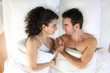 Couple lying in bed