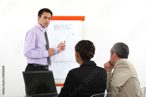 Photo: Businessman making a presentation Businessman making a presentation