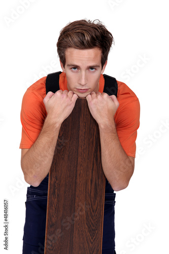 Photo: Man with a wooden plank Man with a wooden plank