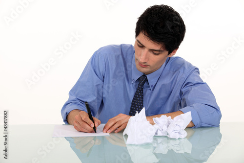 Photo: Man writing a letter Man writing a letter