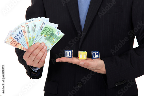 Photo: Banknotes and letter blocks Banknotes and letter blocks