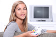 Young woman on games console
