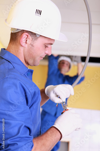 Photo: electrician with cable electrician with cable