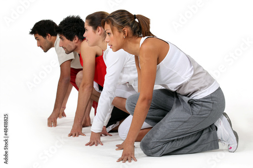 Photo: Four athletes ready for a race Four athletes ready for a race