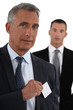 Executive with a blank business card