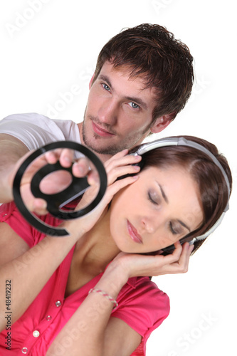 Photo: Email symbol and woman listening to music Email symbol and woman listening to music