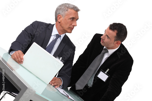 Photo: Two businessmen awaiting conference Two businessmen awaiting conference