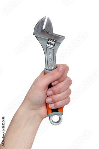 Photo: hand holding a spanner hand holding a spanner