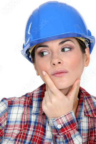Photo: Pensive female builder Pensive female builder