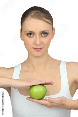 Photo: woman with apple in hands woman with apple in hands