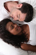 Man and woman laid in bed