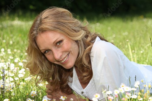 Photo: woman lying on the grass woman lying on the grass
