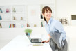 Beautiful young businesswoman working in office