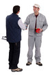 Two manual worker stood together