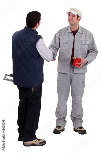 Photo: Two manual worker stood together Two manual worker stood together