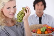 Woman with bunch of grapes