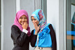 Young asian businesswoman in head scarf  chat togetherm