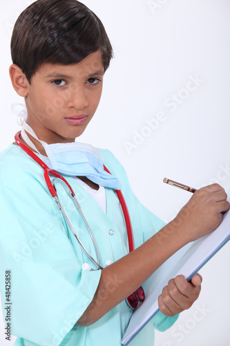 Photo: Little boy with chart dressed-up as doctor Little boy with chart dressed-up as doctor