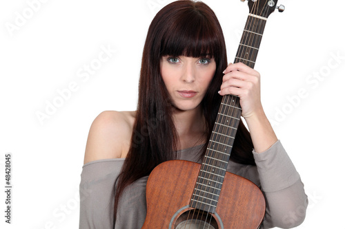 Photo: Woman with a guitar Woman with a guitar