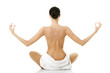 Young beautiful nude woman with towel practicing zoga