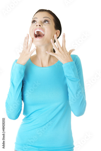 Photo: Shocked and excited woman looking up Shocked and excited woman looking up