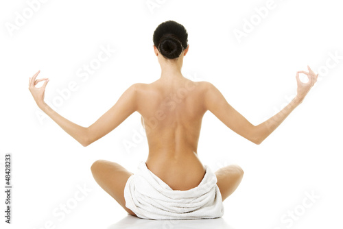 Photo: Young beautiful nude woman with towel practicing zoga Young beautiful nude woman with towel practicing zoga