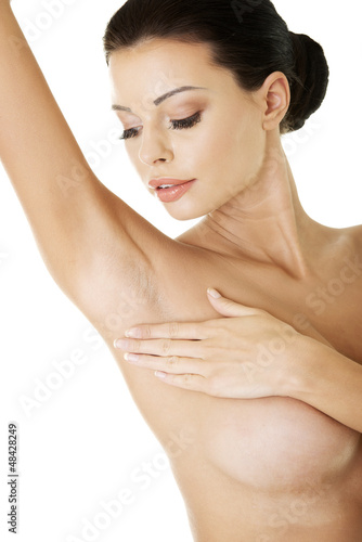 Photo: Woman's touching her armpit Woman's touching her armpit