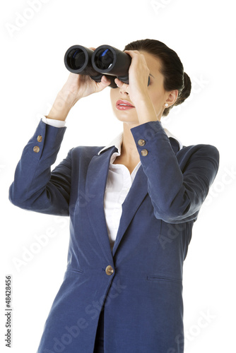 Photo: Businesswoman with binoculars. Businesswoman with binoculars.