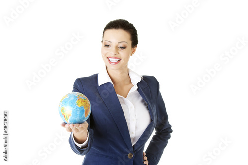 Photo: Young beautiful businesswoman holding the globe Young beautiful businesswoman holding the globe