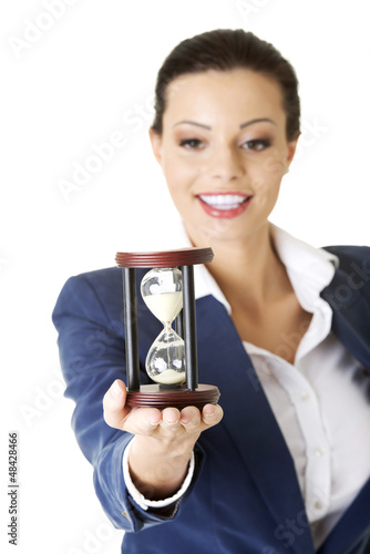 Photo: Young business woman with hourglass Young business woman with hourglass