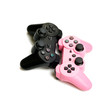 Pink and black gamepads isolated on white background