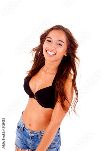Photo: Beautiful young woman dressing bikini and shorts Beautiful young woman dressing bikini and shorts