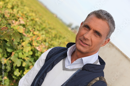 Photo: Farmer in vineyard Farmer in vineyard