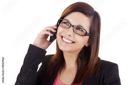 Photo: Young woman talking on mobile phone Young woman talking on mobile phone