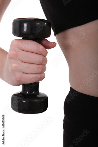 Photo: close-up of a hand taking a dumbbell close-up of a hand taking a dumbbell