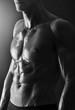 Photo: Detail of a young shirtless muscular man Detail of a young shirtless muscular man