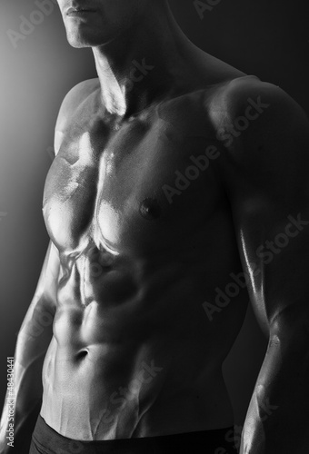 Photo: Detail of a young shirtless muscular man Detail of a young shirtless muscular man