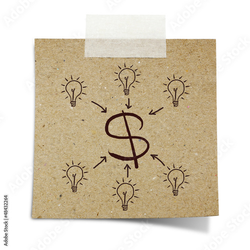 Photo: hand draw light bulb and dollar sign on note taped recycle pape hand draw light bulb and dollar sign on note taped recycle pape
